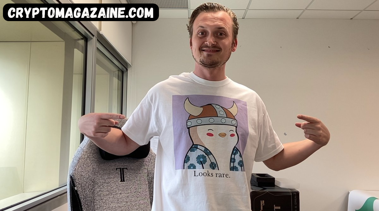 Person wearing a rare-themed t-shirt.